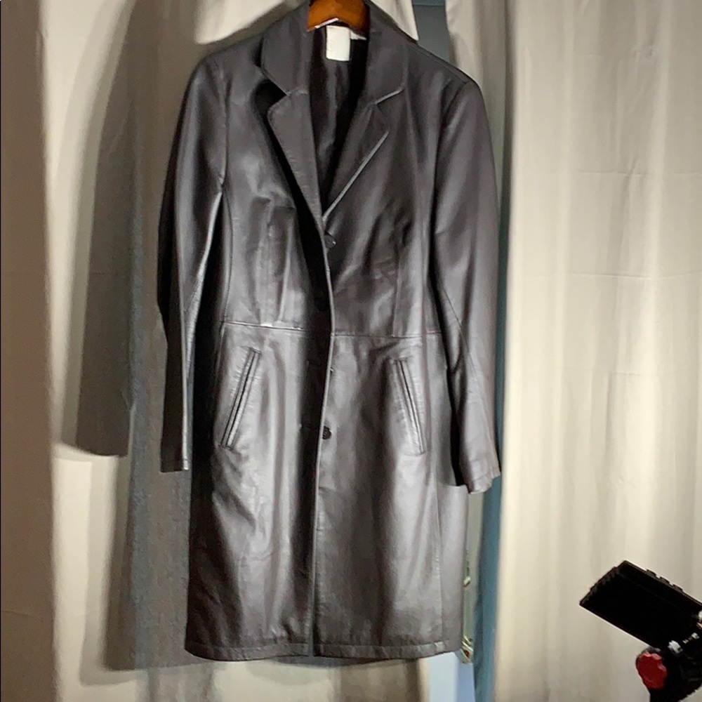 Brown leather mid length coat design in france